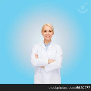 healthcare and medicine concept - smiling female doctor over blue background