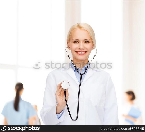 healthcare and medicine concept - smiling female doctor with stethoscope