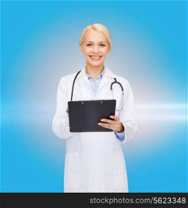 healthcare and medicine concept - smiling female doctor with stethoscope and clipboard