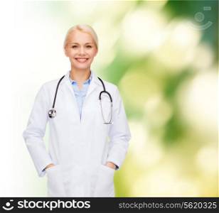 healthcare and medicine concept - smiling female doctor with stethoscope over blue background
