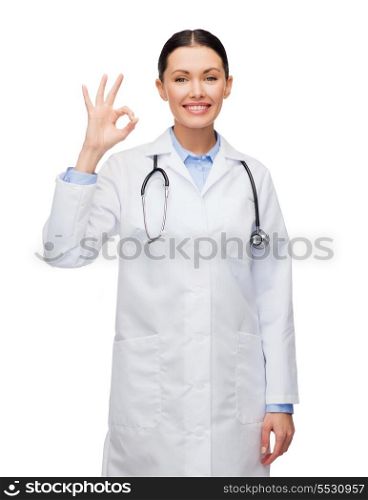 healthcare and medicine concept - smiling female doctor with stethoscope showing okay gesture