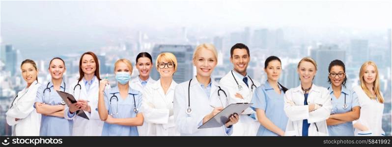 healthcare and medicine concept - smiling female doctors and nurses with stethoscope