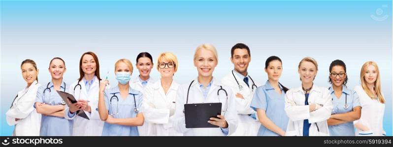 healthcare and medicine concept - smiling female doctors and nurses with stethoscope. smiling female doctors and nurses with stethoscope