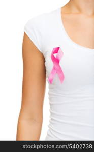 healthcare and medicine concept - woman in blank t-shirt with pink breast cancer awareness ribbon