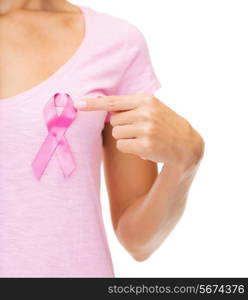 healthcare and medicine concept - woman in blank t-shirt with pink breast cancer awareness ribbon