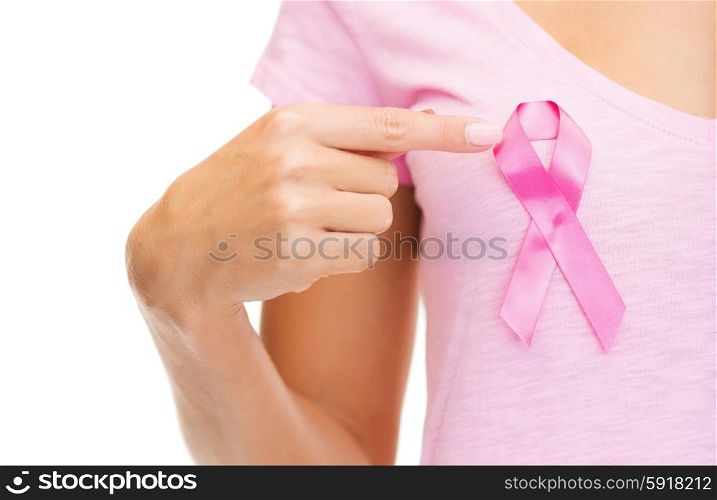 healthcare and medicine concept - woman in blank t-shirt with pink breast cancer awareness ribbon. woman with pink cancer awareness ribbon