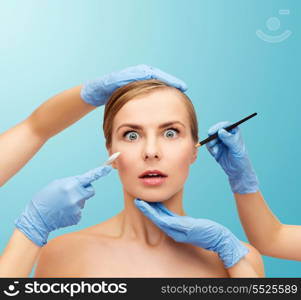 healthcare, beauty and medicine concept - beautiful woman face and beautician hands with pencil and scalpel