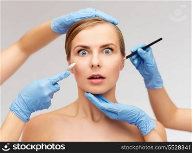 healthcare, beauty and medicine concept - beautiful woman face and beautician hands with pencil and scalpel