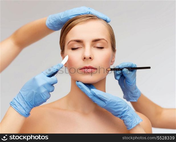 healthcare, beauty and medicine concept - beautiful woman face with closed eyes and beautician hands with pencil and scalpel