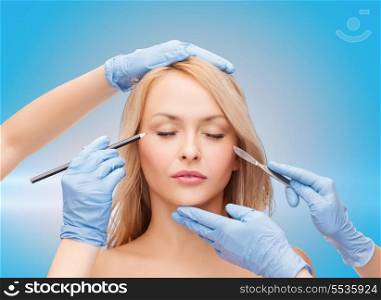 healthcare, beauty and medicine concept - beautiful woman face with closed eyes and beautician hands with pencil and scalpel