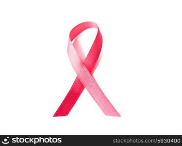 healthcare, charity, symbolics, oncology and medicine concept - close up of pink cancer awareness ribbon