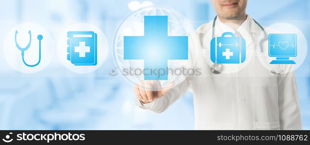 Healthcare Concept - Doctor points at medical cross with other medical icons showing patient caring and health examination technology display on blue abstract background.