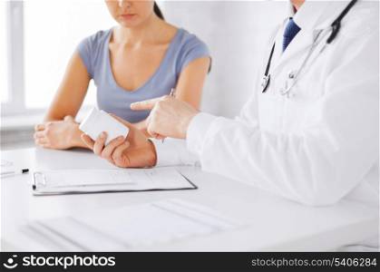 healthcare, hospital and medical concept - patient and doctor prescribing medication