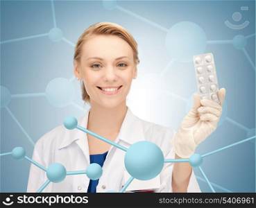 healthcare, hospital, research, science and medical concept - attractive female doctor with pills