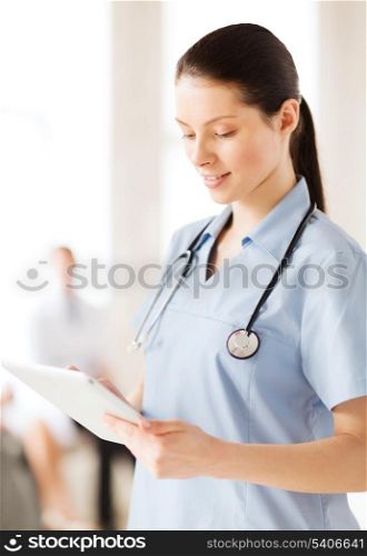 healthcare, medical and technology concept - female doctor with tablet pc
