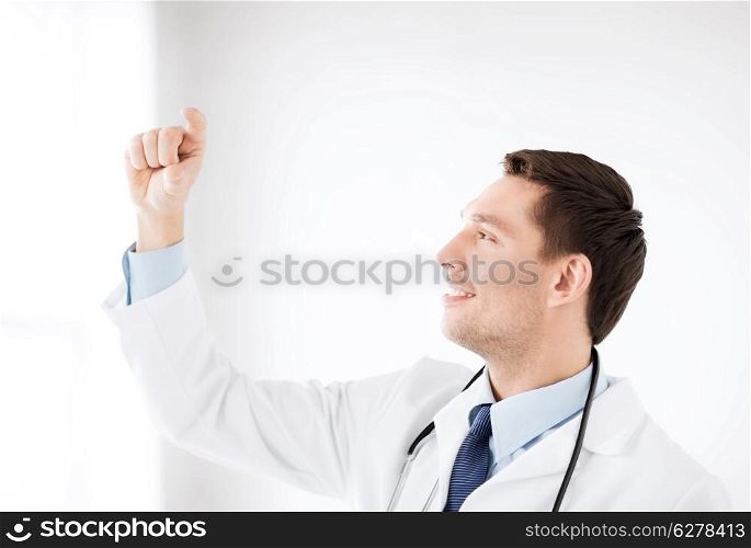 healthcare, medical and technology - young doctor holding something imaginary