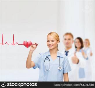 healthcare, medical and technology - young doctor or nurse drawing electrocardiogram