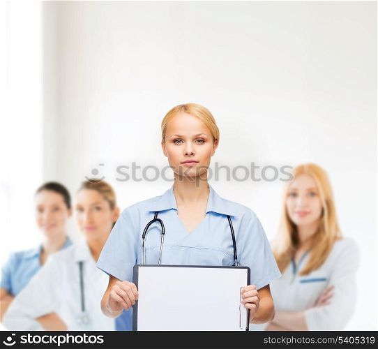 healthcare, medicine, advertisement and sale concept - smiling female doctor or nurse with stethoscope and white blank clipboard