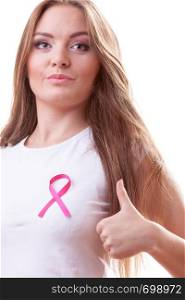 Healthcare, medicine and breast cancer awareness concept. Content young woman with pink cancer ribbon on chest making thumb up hand gesture, isolated on white. woman pink cancer ribbon on chest making thumb up