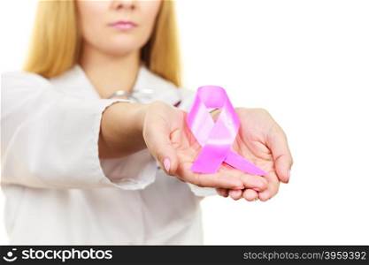 Healthcare, medicine and breast cancer awareness concept. Doctor showing pink ribbon aids symbol