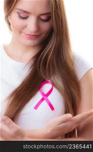 Healthcare, medicine and breast cancer awareness concept - woman in t-shirt with pink cancer ribbon isolated