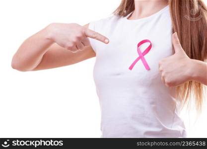 Healthcare, medicine and breast cancer awareness concept. Young woman with pink cancer ribbon on chest making thumb up hand gesture, isolated on white. woman pink cancer ribbon on chest making thumb up