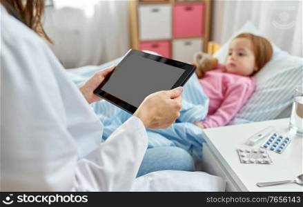 healthcare, medicine and people concept - close up of doctor with tablet pc computer and little sick girl lying in bed at home. doctor with tablet computer and sick girl in bed