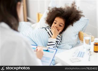 healthcare, medicine and people concept - doctor with clipboard and coughing little sick african american girl lying in bed at home. doctor with clipboard and sick girl in bed at home
