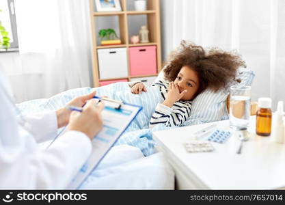 healthcare, medicine and people concept - doctor with clipboard talking to coughing little sick african american girl lying in bed at home. doctor with clipboard and sick girl in bed at home