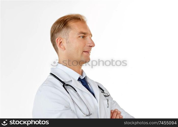 healthcare, medicine and profession concept - smiling male doctor in coat over white background. smiling doctor in white coat at medical office
