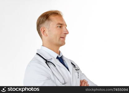 healthcare, medicine and profession concept - smiling male doctor in coat over white background. smiling doctor in white coat at medical office