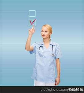 healthcare, medicine and technology concept - smiling young doctor or nurse drawing red checkmark into checkbox