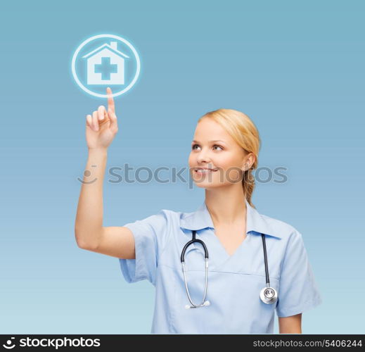 healthcare, medicine and technology concept - smiling young doctor or nurse pointing to hospital icon