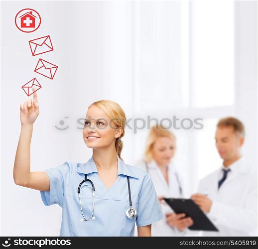 healthcare, medicine and technology concept - smiling young doctor or nurse pointing to red envelope