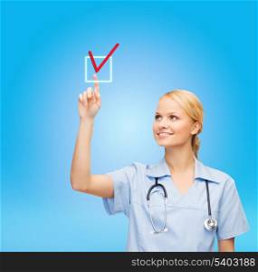 healthcare, medicine and technology concept - smiling young doctor or nurse selecting