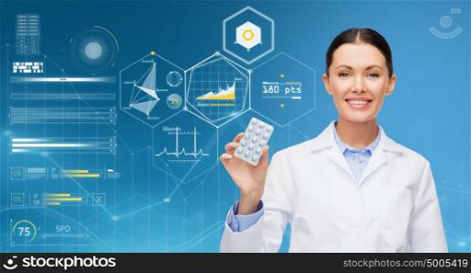 healthcare, medicine, people and technology concept - happy smiling doctor with pills over blue background and virtual charts. happy doctor over blue background and charts