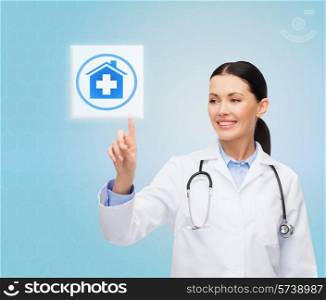healthcare, medicine, people and technology concept - smiling young doctor or nurse pointing to icon or pressing button with pills and blood images over blue background