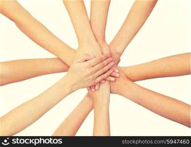 healthcare, people, gesture and medicine concept - close up of women hands on top of each other over white background