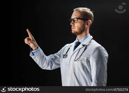 healthcare, people, profession and medicine concept - male doctor in white coat with stethoscope touching something imaginary over black background