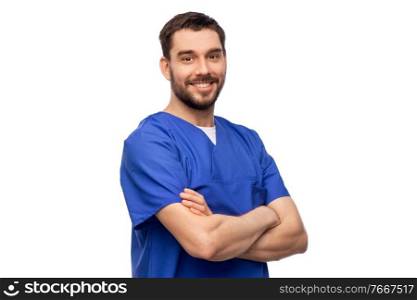 healthcare, profession and medicine concept - happy smiling doctor or male nurse in blue uniform with crossed arms over white background. happy smiling doctor or male nurse in blue uniform