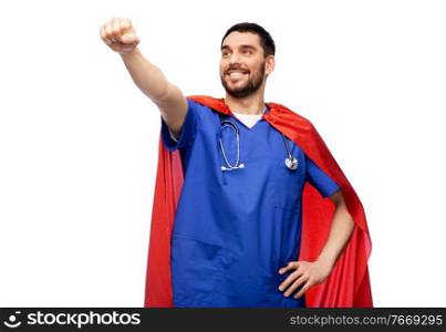 healthcare, profession and medicine concept - happy smiling doctor or male nurse in blue uniform and red superhero cape with stethoscope over white background. smiling doctor or male nurse in superhero cape