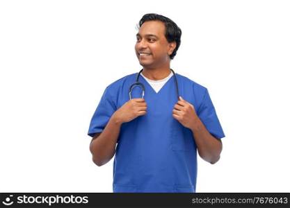 healthcare, profession and medicine concept - happy smiling indian doctor or male nurse in blue uniform with stethoscope over white background. happy indian doctor or male nurse with stethoscope