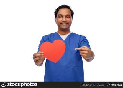 healthcare, profession and medicine concept - happy smiling indian doctor or male nurse in blue uniform with red heart over white background. smiling male doctor with red heart on clipboard