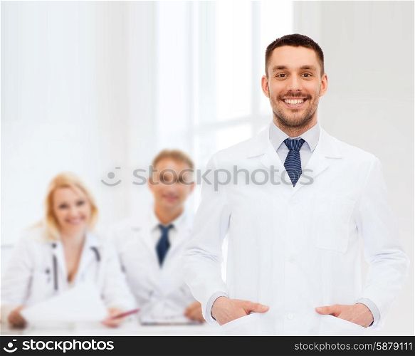 healthcare, profession and medicine concept - smiling male doctor in white coat over white background