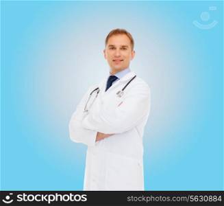 healthcare, profession and medicine concept - smiling male doctor with stethoscope in white coat over blue background