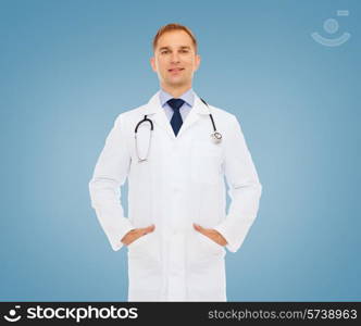 healthcare, profession and medicine concept - smiling male doctor with stethoscope in white coat over blue background