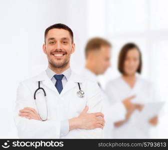 healthcare, profession and medicine concept - smiling male doctor with stethoscope in white coat over white background