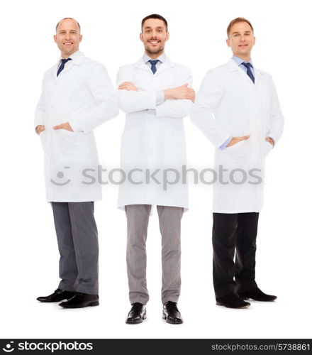 healthcare, profession and medicine concept - smiling male doctors in white coats over white background