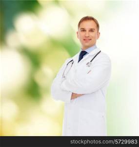 healthcare, profession, environment and medicine concept - smiling male doctor with stethoscope in white coat over nature background