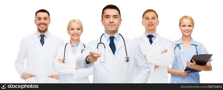 healthcare, profession, gesture, people and medicine concept - group of doctors with stethoscopes and clipboard pointing at you